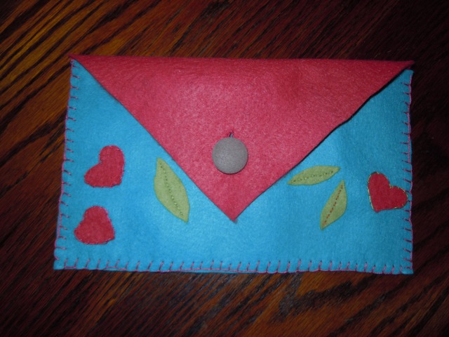 Having bought the candies, I needed packaging for them, so made this envelope, with a button from my favorite dress of all time...