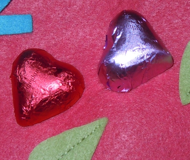 Dark Lake Champlain chocolate hearts, one with a chocolate raspberry ganache filling...